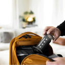 The Travel Set — an AeroPress being packed into a backpack