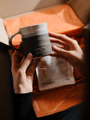 A stoneware mug and a bag of Coffeeangel coffee in the open gift box