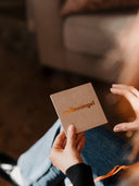 The Coffee Card Bundle box, held in one hand