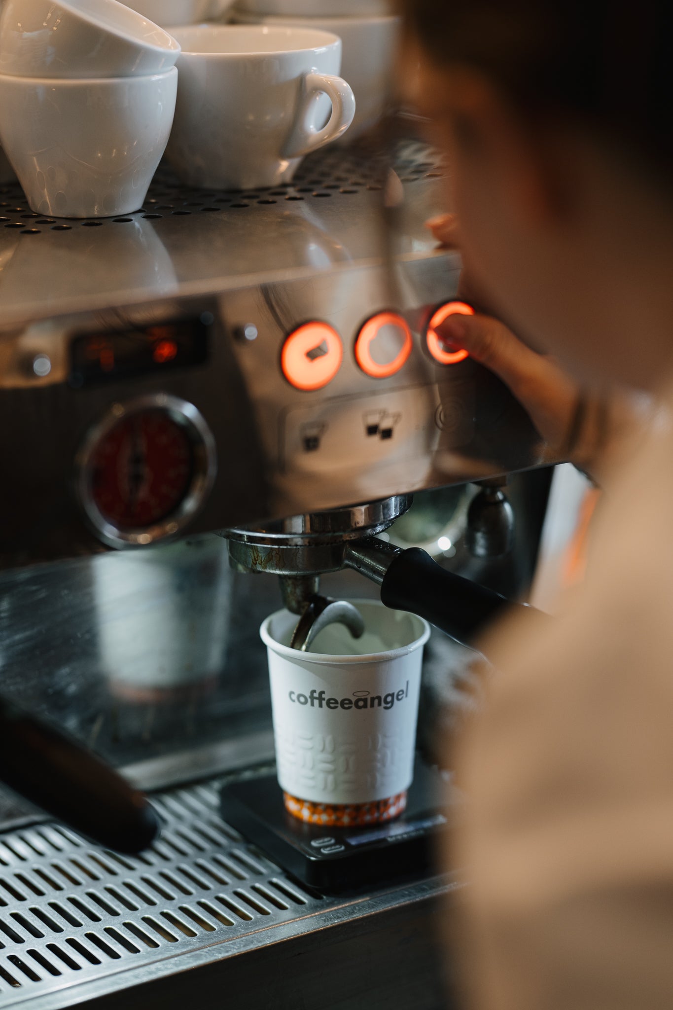 Espresso being extracted into a Coffeeangel cup