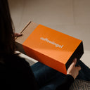 An open Coffeeangel coffee gift box with a bag of freshly roasted coffee